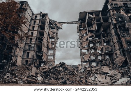destroyed and burned houses in the city Russia Ukraine war Royalty-Free Stock Photo #2442232053
