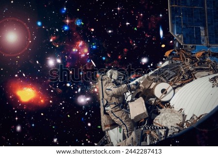 Astronaut surfing dark space with stars. The elements of this image furnished by NASA.

