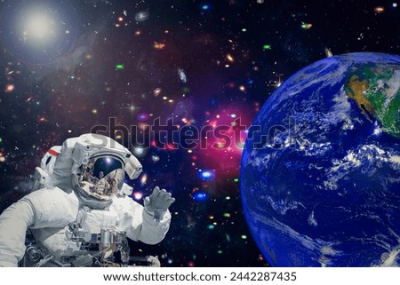 Astronaut and stars on the backdrop. The elements of this image furnished by NASA.

