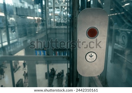 elevator buttons for blind person in modern building, braille lift buttons, airport terminal