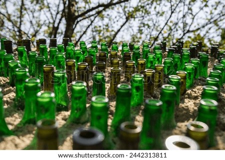 Pattern of glass bottles as decoration in a wall