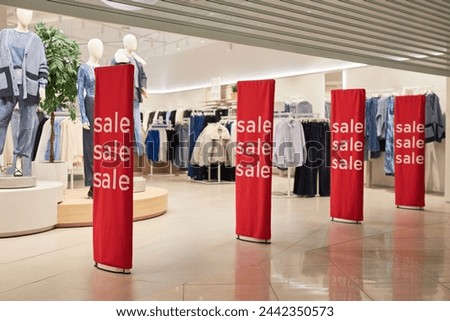 Background image of storefront with sale signs in shopping mall interior no people
