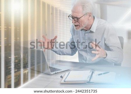 Enraged businessman in front of his laptop; multiple exposure Royalty-Free Stock Photo #2442351735