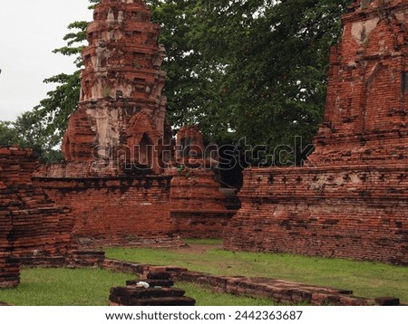 Ayutthaya, Thailand, Asia - 10 05 2010 : Exterior photo visual view of teh famous sight seeing remain ruins of Nakhon Si, the templs of great relic with abandoned damaged temple construction 