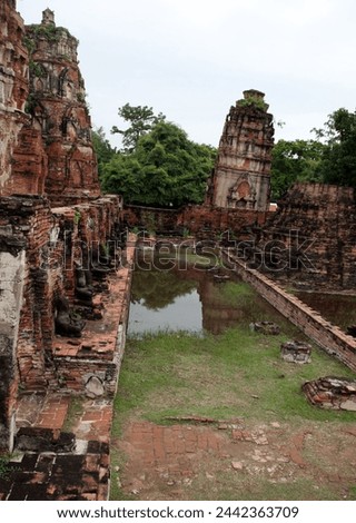 Ayutthaya, Thailand, Asia - 10 05 2010 : Exterior photo visual view of teh famous sight seeing remain ruins of Nakhon Si, the templs of great relic with abandoned damaged temple construction 