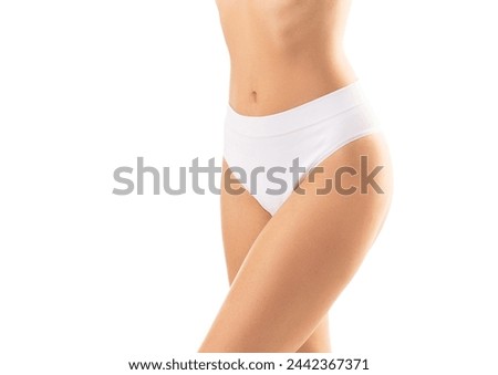 Young, fit and beautiful woman in white swimsuit over white background. The concept of healthcare, diet, sport and fitness.