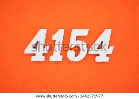 Orange felt is the background. The numbers 4154 are made from white painted wood.