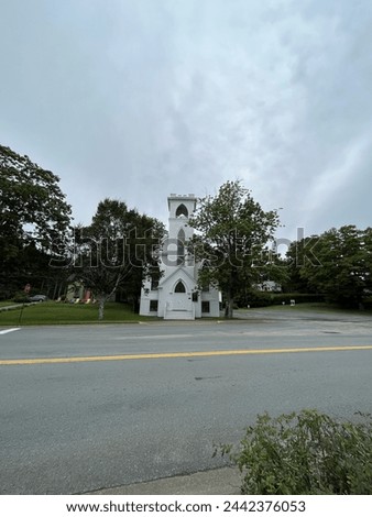 The front exterior of the Trinity United Church in Mahone Bay, NS. Royalty-Free Stock Photo #2442376053