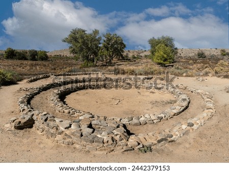 Hubbard site at Aztec Ruins National Monument in New Mexico. Best preserved Chacoan structures built by ancestral Pueblo people. Three concentric walls, 22 rooms surrounding a kiva. Tri-wall dwelling. Royalty-Free Stock Photo #2442379153