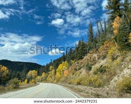 High Road to Taos Scenic Byway in New Mexico near Apache Canyon. Beautiful autumn colors, rugged terrain of the Sangre de Cristo Mountains, Carson National Forest. New Mexico highway 518. Royalty-Free Stock Photo #2442379231