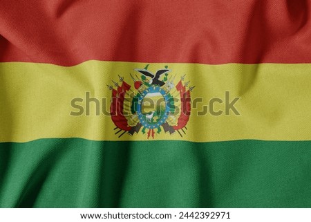 National Flag on Textured Fabric Background. Silk textured flag, realistic wave and flag look. BO  Flag of Bolivia