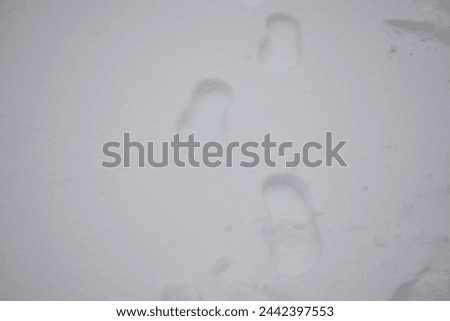 Human footprints on the white snow