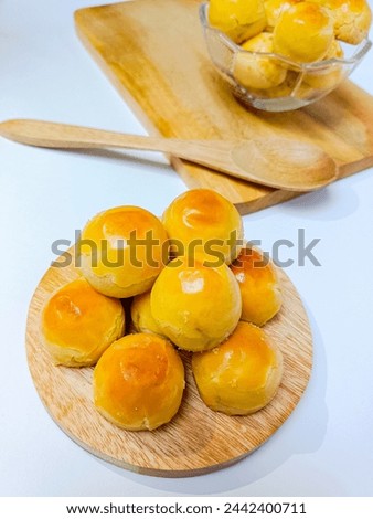 Homemade Nastar or Pineapple Tart; a small, bite-size tart filled or topped with pineapple jam. Commonly found in Indonesia during Ramadan, Lebaran, or Idul Fitri.  Royalty-Free Stock Photo #2442400711