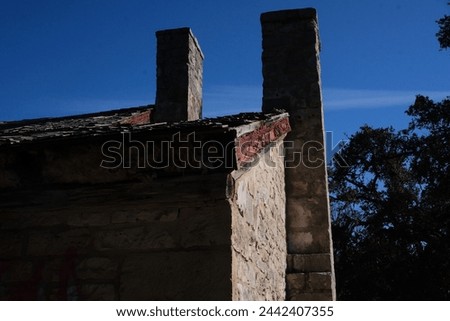 an abandoned house in Austin Texas with blue skies