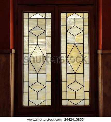 Photo of vintage windows decorated with geometric patterns.
