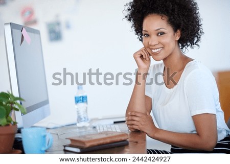 Young woman, confidence and portrait at computer for creative project, planning or copywriting career. Face of professional editor, writer or African person on desktop at creative or business startup