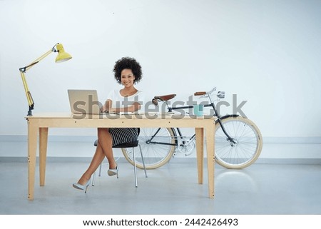 Business woman, planning and office desk for creative project, research and online editing or copywriting. Portrait of a young professional editor or African person on laptop and notebook for startup