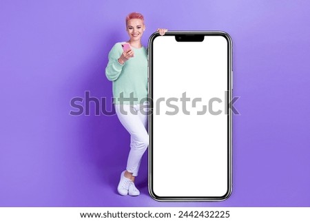 Full length photo of positive pretty girl wear turquoise sweater communicating modern device empty space isolated violet color background