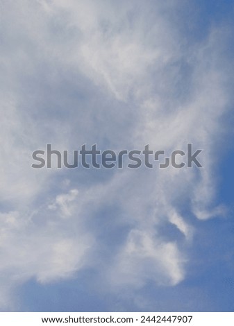 Photo of blue sky and wispy clouds. Great for background picture or just to relax and dream.