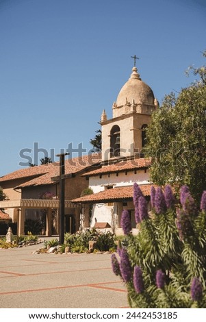 Carmel Mission with flowers from garden Royalty-Free Stock Photo #2442453185