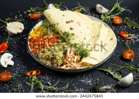 Mexican tacos on pita with vegetables salad, meat, pepper and corn on rustic wooden white table background. Recipe traditional food. Top flat view, overhead.