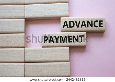 Advance Payment symbol. Concept words Advance Payment on wooden blocks. Beautiful pink background. Business and Advance Payment concept. Copy space