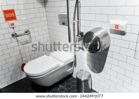 A toilet for the disabled with a SOS emergency  button