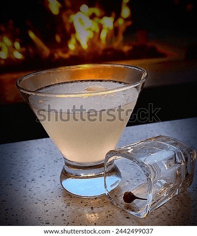 Handcrafted, colorful, unique cocktail. A mixologist’s masterpiece with exquisite sweet and aromatic garnish. A luxurious concoction that excites all of the senses in a stunning libation photograph. Royalty-Free Stock Photo #2442499037