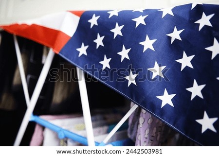 Flapping flag USA with wave. American flag for Memorial Day or 4th of July. Closeup of American flag on dark background