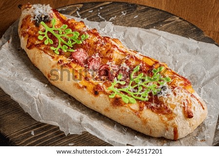 Genoese pizza on the wooden board Royalty-Free Stock Photo #2442517201