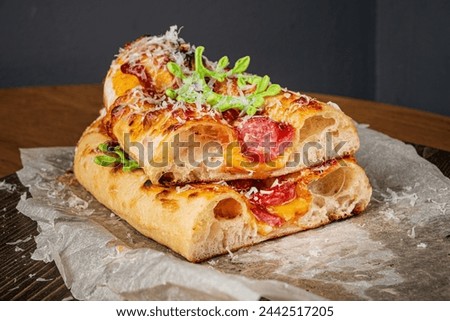 Genoese pizza on the wooden board Royalty-Free Stock Photo #2442517205