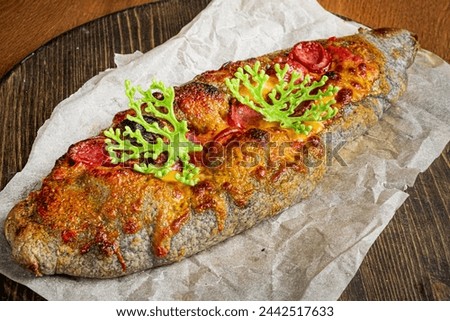 Genoese pizza on the wooden board Royalty-Free Stock Photo #2442517633