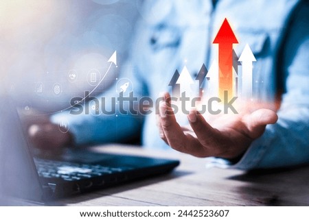 Interest rate and dividend, Businessman hold up arrow icon and percentage with graph indicators for investment growth. business financial investment, business growth, income, marketing and profit.