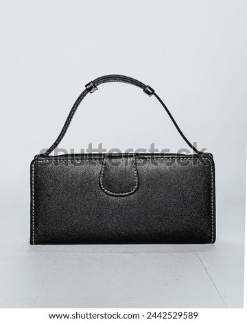 women's wallet crafted from premium black leather. March 24,2024, Punjab, Pakistan