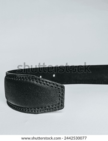 This high-resolution photo features a men’s black leather belt, a staple accessory in any wardrobe. Crafted with precision, the belt showcases premium quality 24,March 2024, Daska, Pakistan