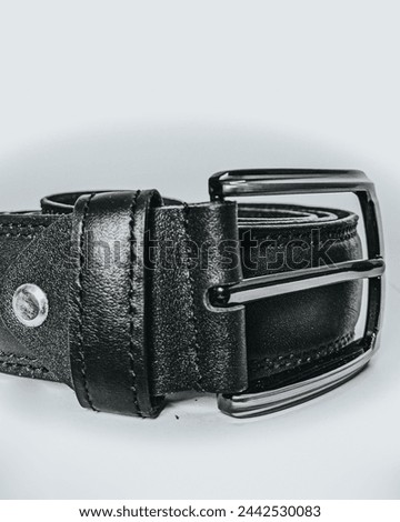 This high-resolution photo features a men’s black leather belt, a staple accessory in any wardrobe. Crafted with precision, the belt showcases premium quality 24,March 2024, Daska, Pakistan