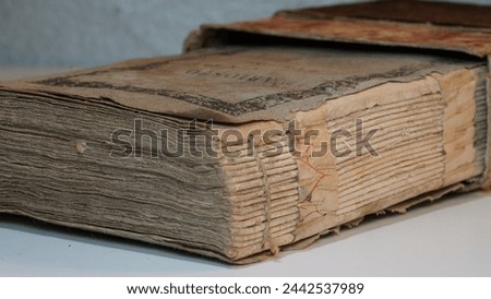 Ethereal echoes: An archaic Italian language tome printed in Piacenza (Italy). 1813 AC. - Text translation " Volume Five... Printed by Torchi del Majno. 1813 AD ".  Antique book collection. Royalty-Free Stock Photo #2442537989