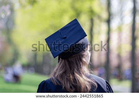 Back of someone wearing a graduation cap
