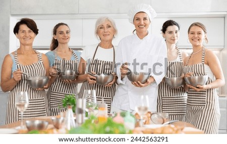 Group picture of members of Cooking courses for women with female chef instructor