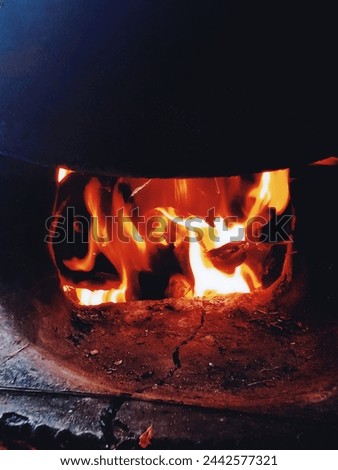 this is a photo about kiln and furnace ( put wood on the fire)