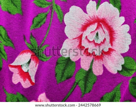 The picture of camellias and tulips on the blanket looks very beautiful