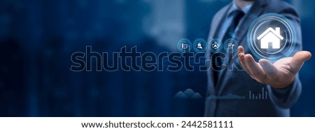Property management Business concept. Businessman Holding the icon on virtual screen