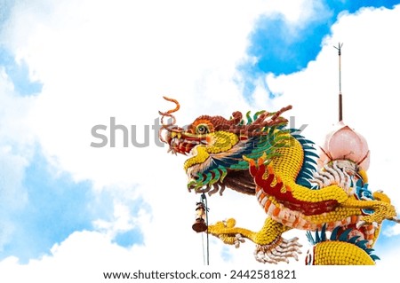 Beautiful Chinese dragon against a bright sky. Culture, good luck, respect.