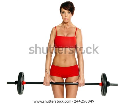 Caucasian woman with barbell wearing red training bikini isolated on white.