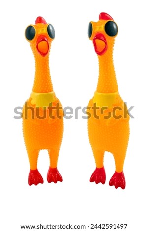 Toy rubber chicken wearing goggles, prank gift, squeaky toy Royalty-Free Stock Photo #2442591497