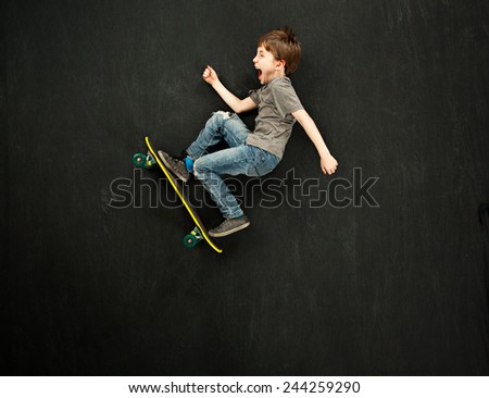 Young boy on a skateboard Royalty-Free Stock Photo #244259290