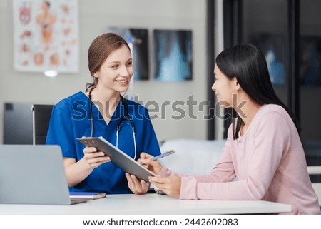 Depression Asian female patient talking with psychiatrist in doctor office Let's talk about the results of the health examination at the clinic.
