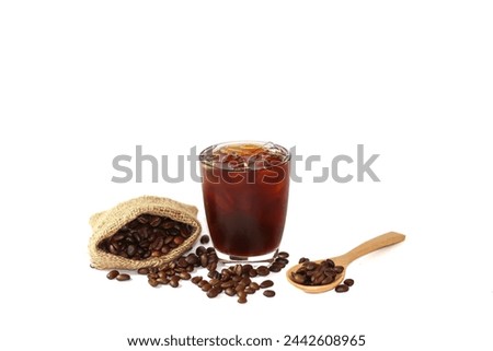 Americano ice coffee and coffee beans and spoons spread on white background with isolated picture.