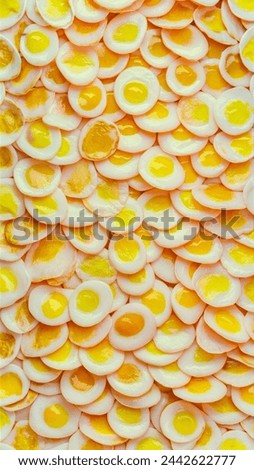 Random pictures of fried eggs, one on top of the other that cover the entire picture.