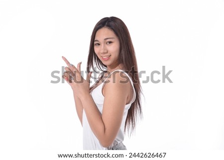 Portrait of young woman with two finger point up
